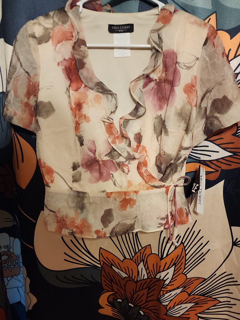 Miss Dorby Floral Ruffle Wrap Blouse in Cream with Blush and Peach